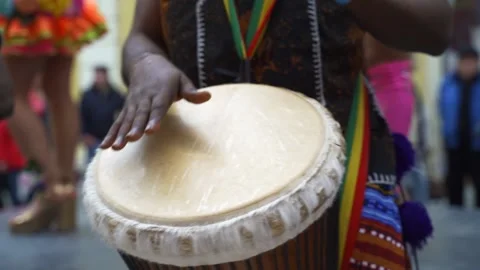 Man playing drum by his hands. Street performance using percussion instruments Stock Footage 151984709