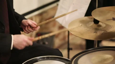 Man is playing a drum set at a concert in Stock Footage 299648575
