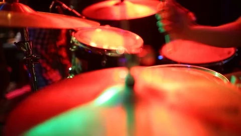 The man is playing drum set in low light background. Stock Footage 123371174