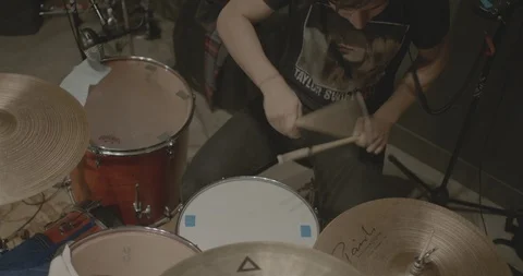Man playing drum set at music concert Stock Footage 107944041