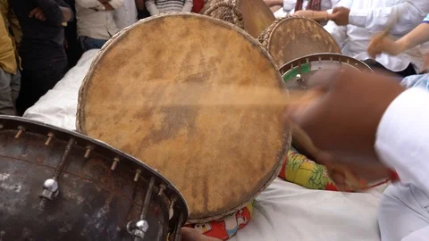 Man playing on a drumon time Pushkar Camel Mela, Rajasthan, India, close up Stock Footage 99944080