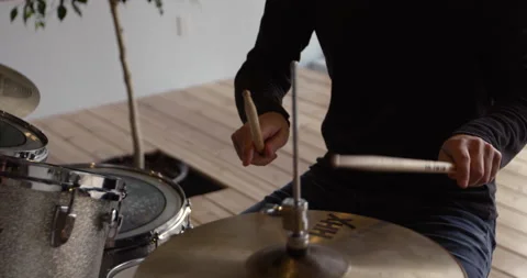 Man playing drums - close up on slow motion drum sticks hitting cymbals Stock Footage 148245862