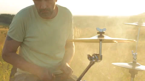 Man playing drums on nature Stock Footage 64840213