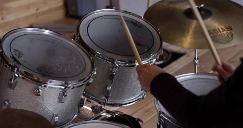 Man playing drums over the shoulder view Stock Footage 148245872