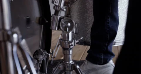 Man playing drums strikes base with foot pedal - close up Stock Footage 148245982