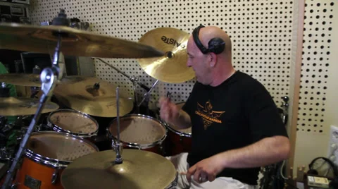 Man playing drums on a studio Stockbeeldmateriaal 33444011