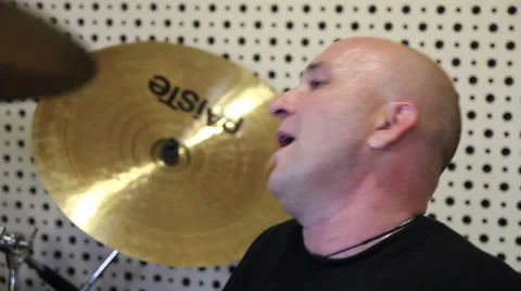 Man playing drums on a studio Stockbeeldmateriaal 33444034