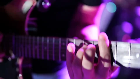 Man playing an electric guitar during a concert Stock Footage 233166759