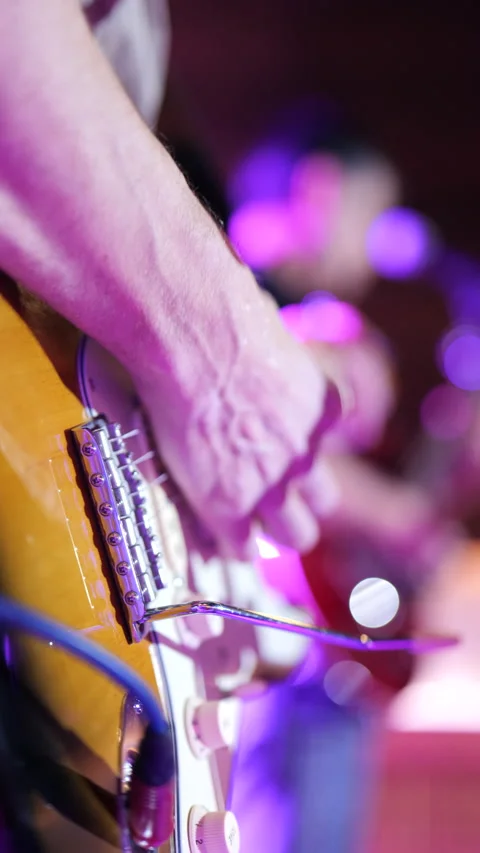 Man playing an electric guitar during a concert. Stock Footage 233242653