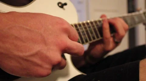Man playing an electric guitar Stock Footage 41534909