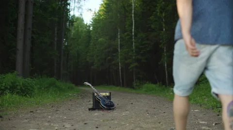 Man is playing at the electric guitar in forest Stock Footage 68352584
