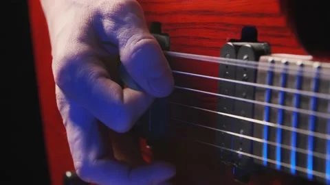 A man is playing electro guitar Stock Footage 156523051
