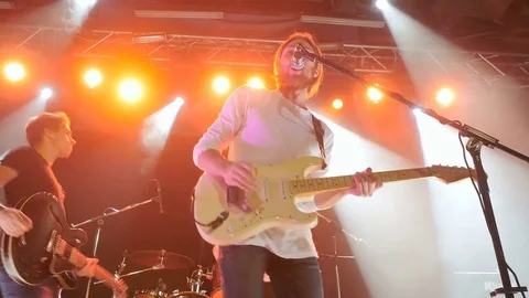 Man playing on an electronic guitar and singing on a rock concert Stock Footage 72344907