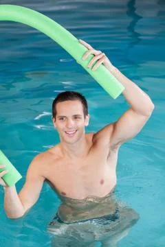 Man playing with float Stock Photos