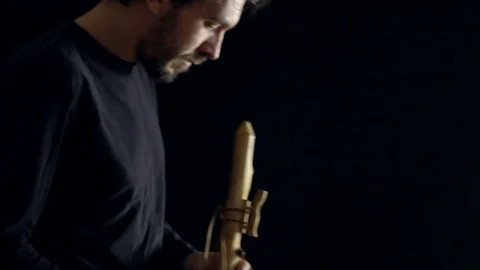 Man playing the flute Stock Footage 100656565