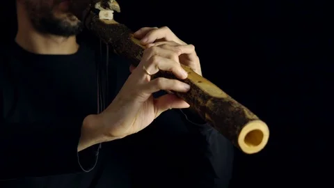 Man playing the flute Stock Footage 101818523