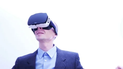 Man playing a fly simulation in VR-headset - 4 K Stock Footage 71210301