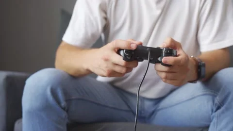 A man playing a game console at home Stock Footage 219530717