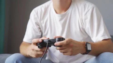 A man playing a game console at home Stock Footage 221260504