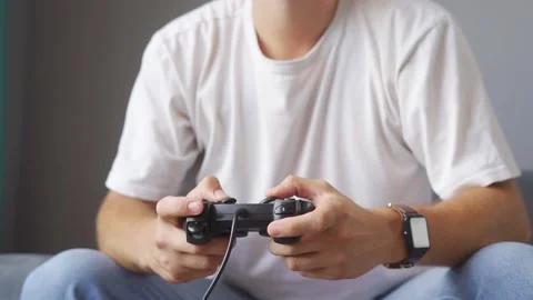 A man playing a game console at home Stock Footage 221260556