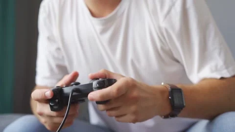 A man playing a game console at home Stock Footage 221398323