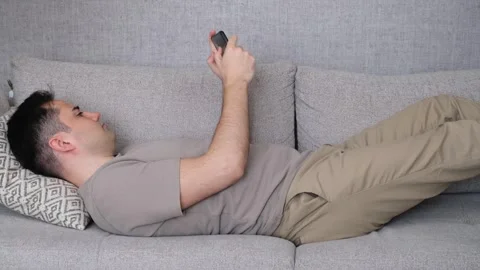 Man playing game smartphone Stock Footage 265392320