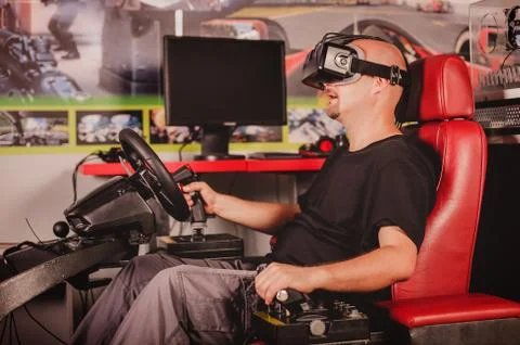 Man playing game in virtual reality glasses Stock Photos