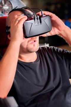 Man playing game in virtual reality glasses Stock Photos