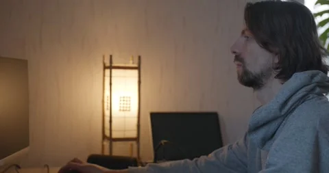 Man is Playing Games on Computer. 4K 10-bit Stock Footage 321320340