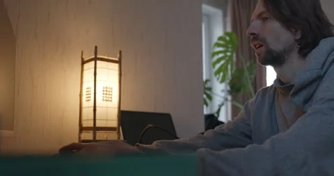 Man is Playing Games on Computer. 4K 10-bit Stock Footage 321320344