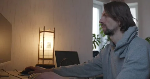 Man is Playing Games on Computer. 4K 10-bit Stock Footage 321320445