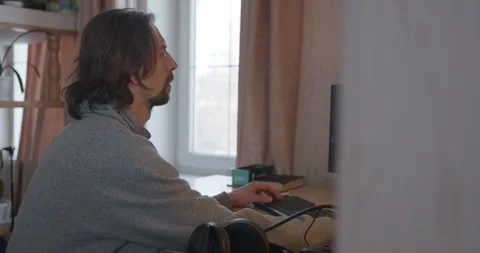 Man is Playing Games on Computer. 4K 10-bit Stock Footage 321320450