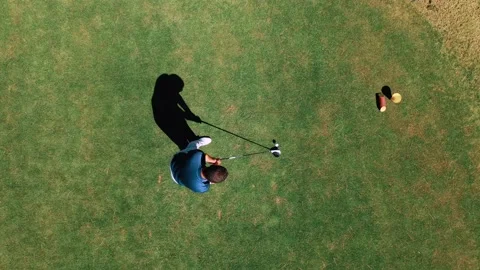 Man playing golf on beautiful course, putting on the green into the hole Stock Footage 172438410