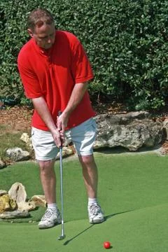 Man playing golf Stock Photos
