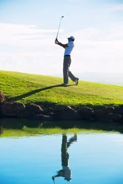 Man playing golf Stock Photos