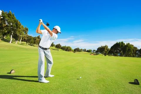 Man playing golf Stock Photos