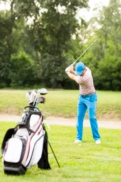 Man playing golf Stock Photos