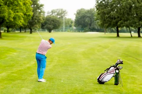 Man playing golf Stock Photos