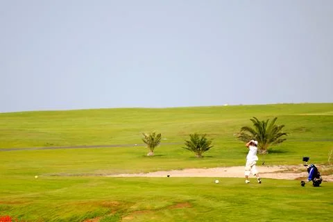 Man playing golf Stock Photos