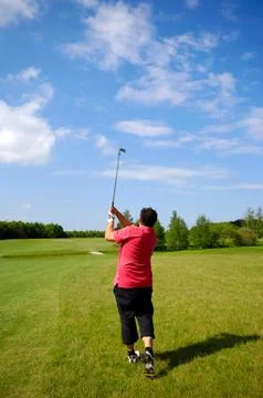 Man playing golf Stock Photos