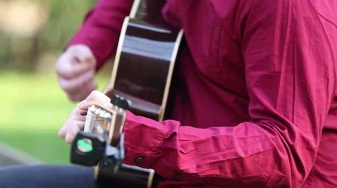 Man playing the guitar and singing Stock Footage 59556488