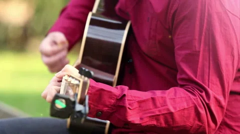 Man playing the guitar and singing Stock Footage 59556495
