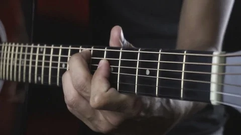 Man playing guitar on black background. Six strings. Playing with fingers Stock Footage 79029867