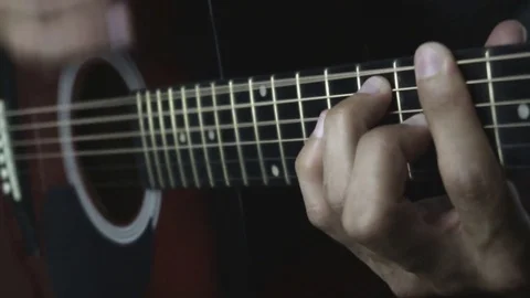 Man playing guitar on black background. Six strings. Playing with fingers Stock Footage 79030485
