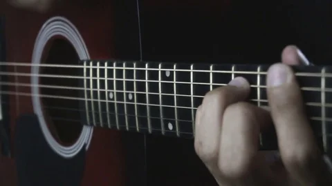 Man playing guitar on black background. Six strings. Playing with fingers Stock Footage 79030696