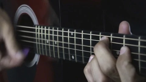 Man playing guitar on black background. Six strings. Playing with fingers Stock Footage 79030876