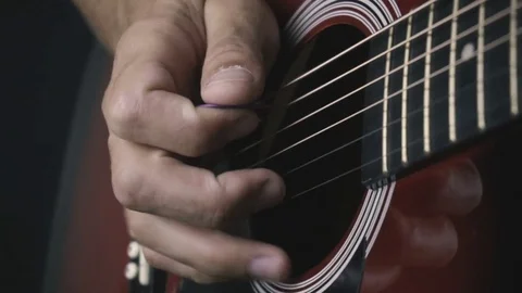 Man playing guitar on black background. Six strings. Playing with fingers Stock Footage 79031139