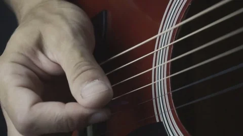 Man playing guitar on black background. Six strings. Playing with fingers Video stock 79032784