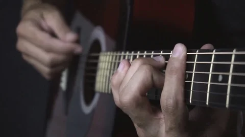 Man playing guitar on black background. Six strings. Playing with fingers Video stock 79036061