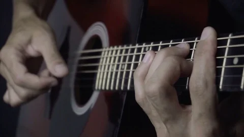 Man playing guitar on black background. Six strings. Playing with fingers Video stock 79036961